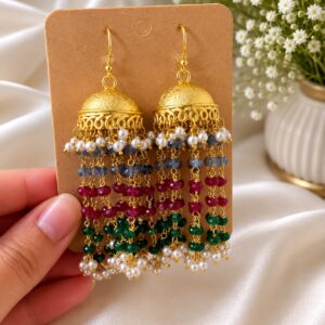 Festive jhumka earrings in gold-plated brass with ornate dome, cascading synthetic pearls and colourful beads