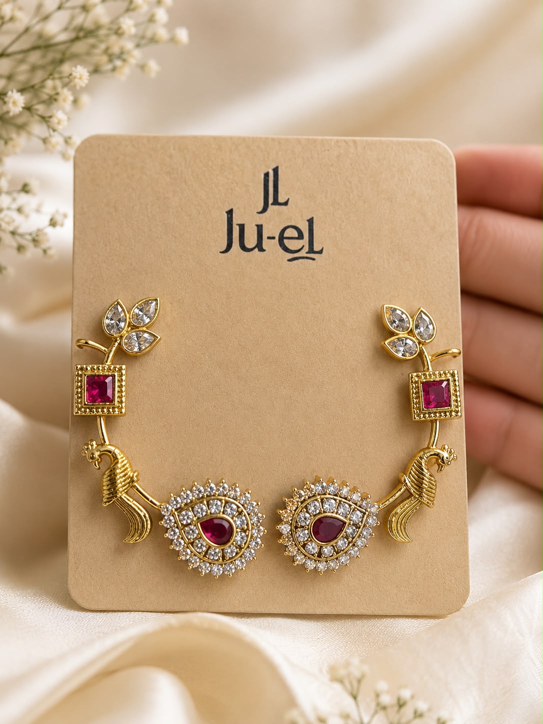 Mrinalini ornate statement earcuff in gold-plated brass with sparkling white and red AD stones